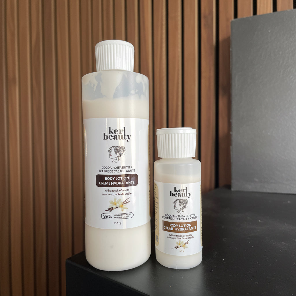 Two bottles of Kerl Beauty sensitive skincare lotion products on a dark surface with a wooden background
